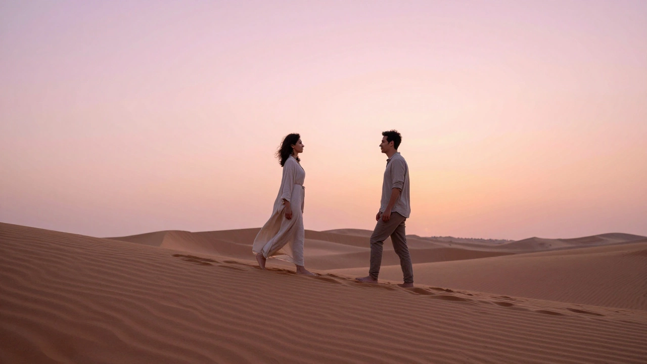 A man and woman walking peacefully along a desert dune at dawn near Dubai.